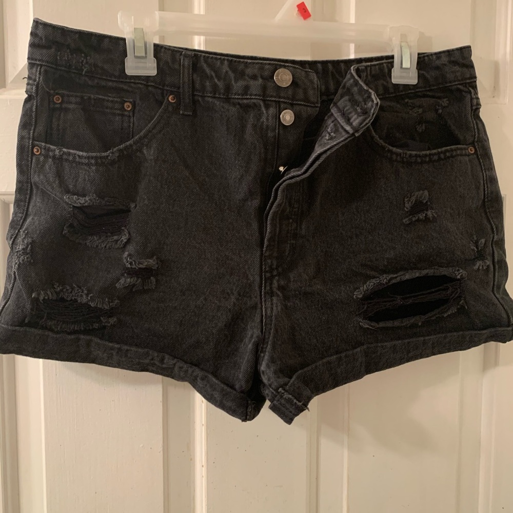 Dark denim distressed high-waist shorts. Button up